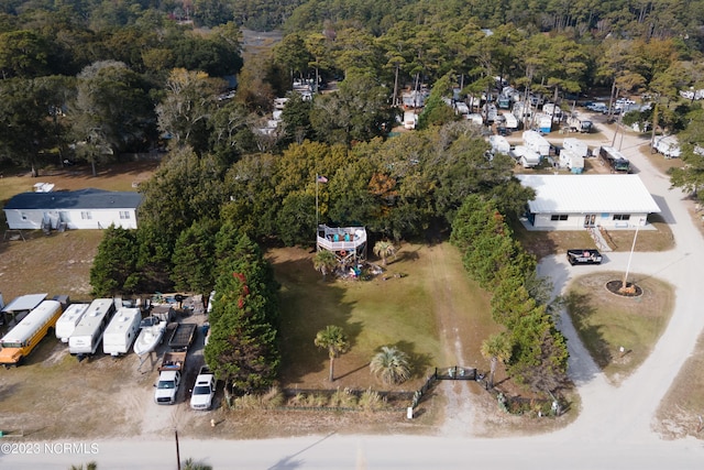 bird's eye view featuring a wooded view