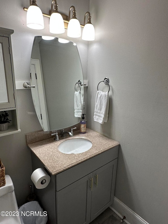 bathroom with vanity and toilet