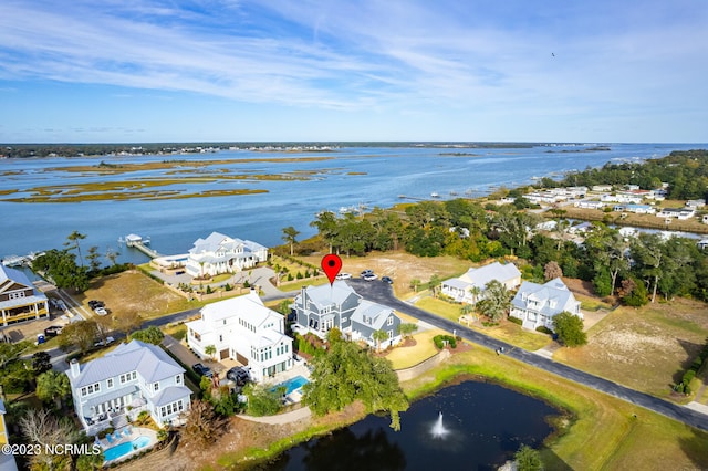 bird's eye view with a water view