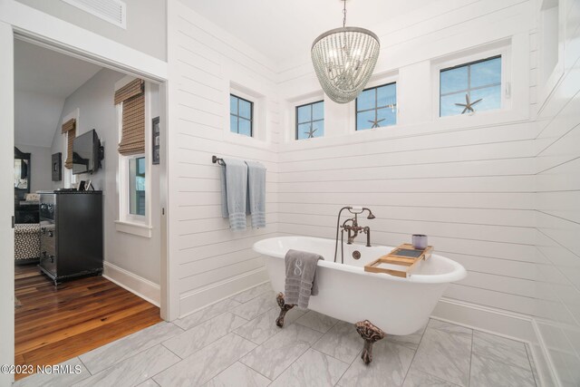 bedroom featuring lofted ceiling, a closet, dark wood-type flooring, a water view, and ceiling fan