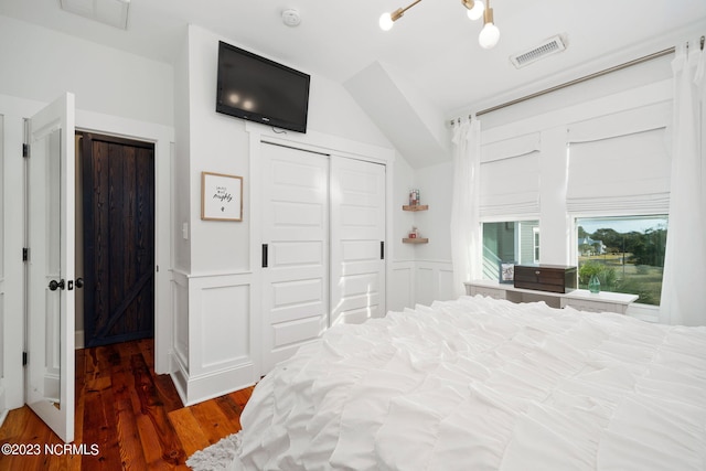 bedroom featuring a closet and dark hardwood / wood-style flooring