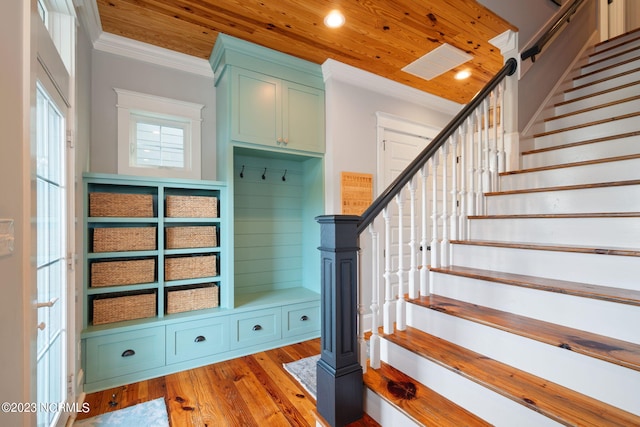 mudroom featuring wood ceiling, ornamental molding, and light wood-type flooring