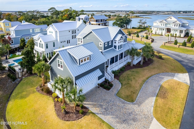 birds eye view of property with a water view