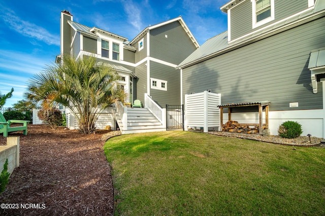 back of property with a yard and a pergola