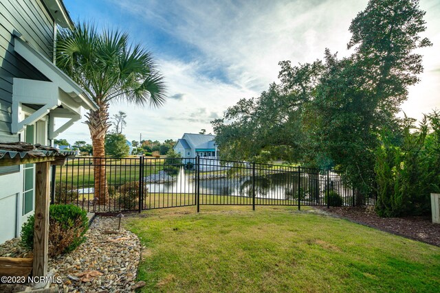 rear view of property featuring a yard