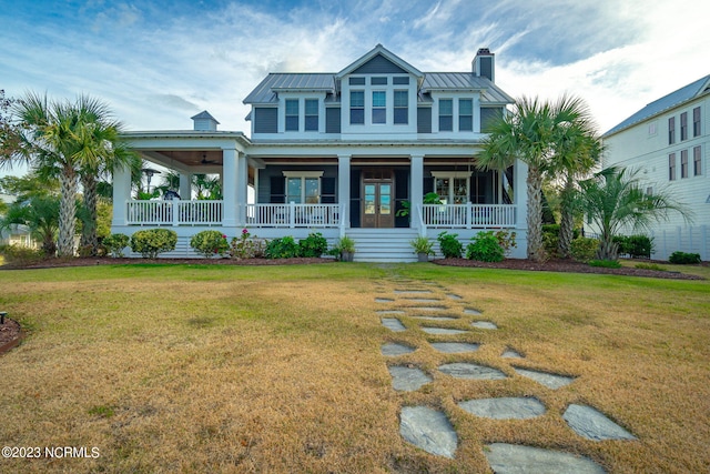 view of front facade featuring a porch and a front lawn