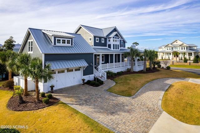 view of front facade with a garage and a front lawn