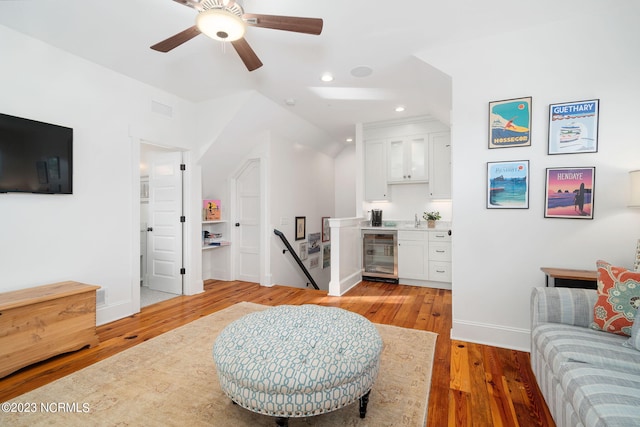 living room featuring light wood-type flooring and wine cooler