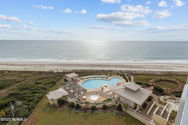 drone / aerial view with a water view and a view of the beach