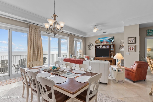 tiled dining room featuring a water view, ceiling fan with notable chandelier, and crown molding