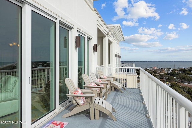 balcony featuring a water view