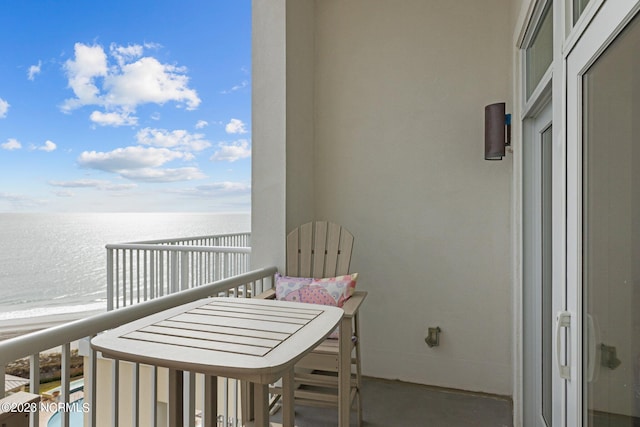 balcony featuring a water view