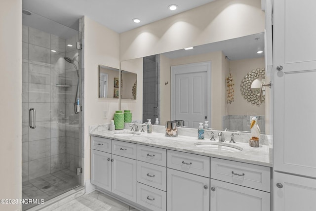 bathroom featuring walk in shower, double sink vanity, and tile flooring