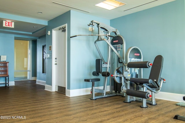 workout area featuring dark hardwood / wood-style flooring