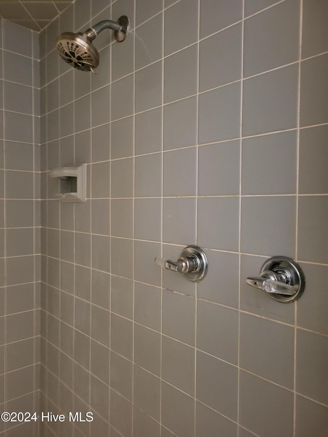 bathroom with tiled shower