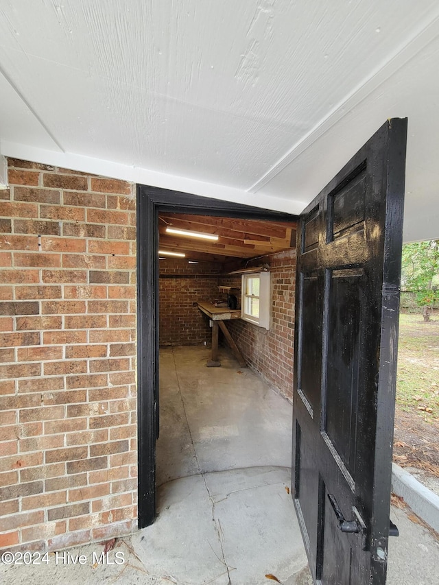 hallway with brick wall