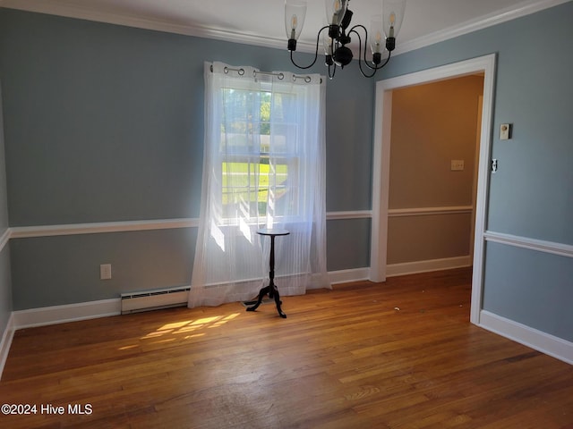 unfurnished dining area featuring crown molding, hardwood / wood-style floors, a notable chandelier, and a baseboard heating unit