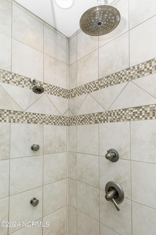 bathroom with a tile shower