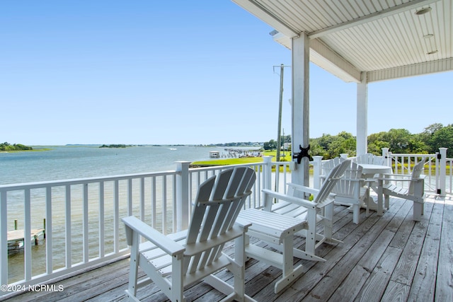 wooden deck featuring a water view