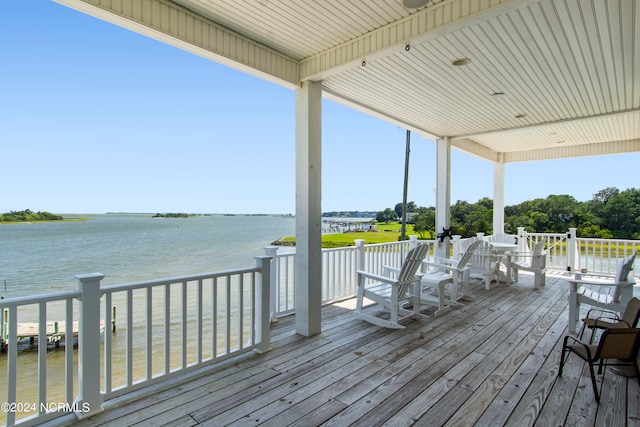 wooden deck with a water view