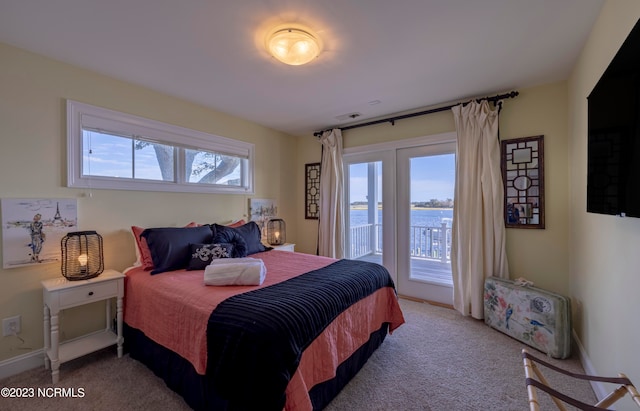 bedroom featuring access to outside and carpet