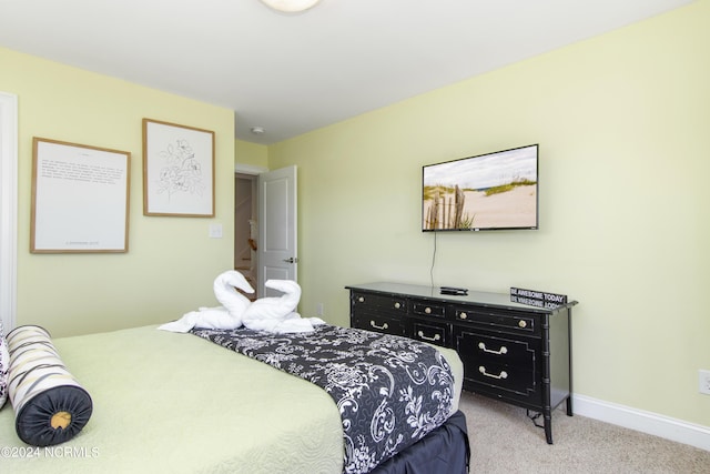 bedroom with light colored carpet