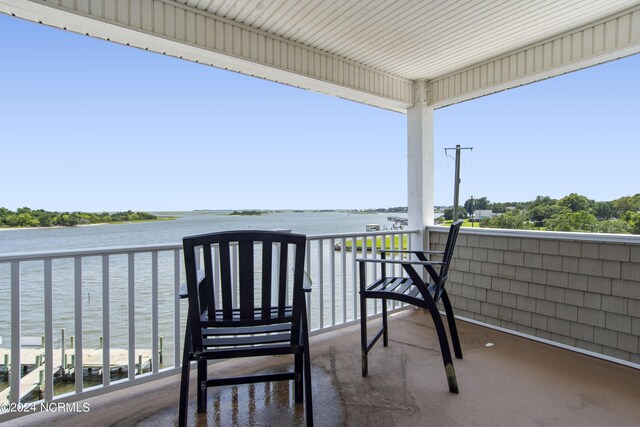 balcony featuring a water view