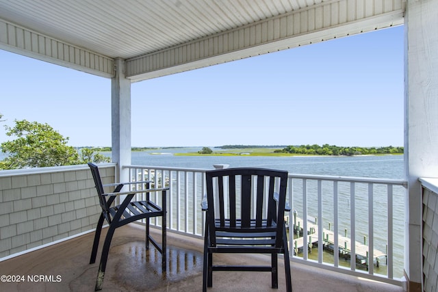 balcony featuring a water view