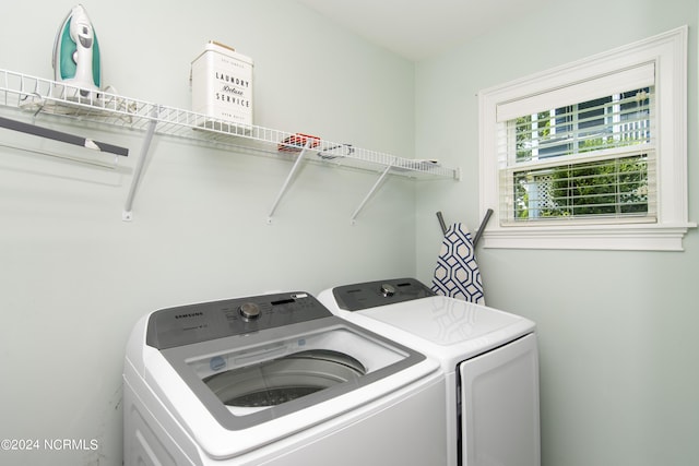 washroom with washing machine and dryer