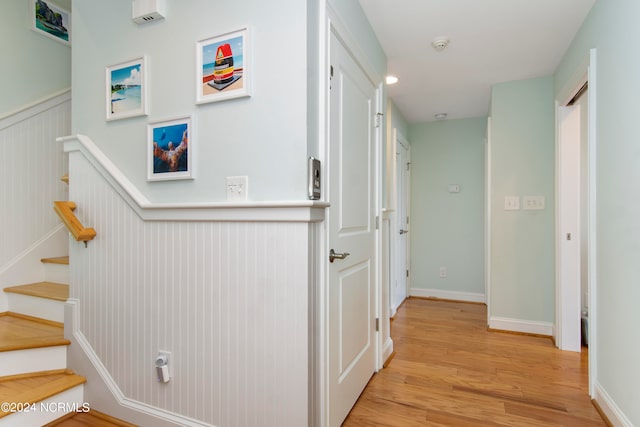 corridor with light hardwood / wood-style flooring