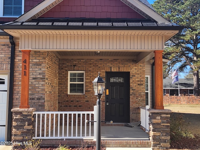 property entrance with covered porch