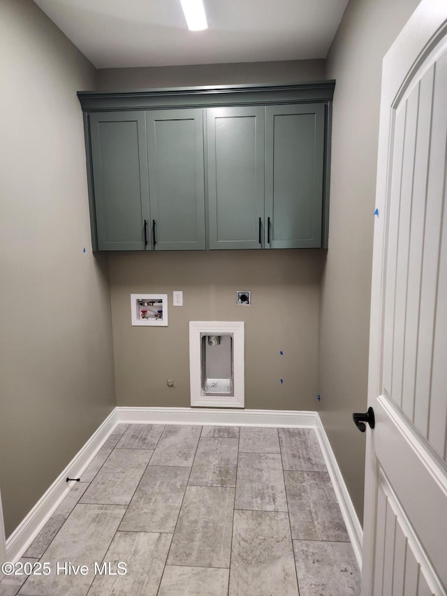 laundry area with hookup for an electric dryer, hookup for a gas dryer, cabinets, and washer hookup