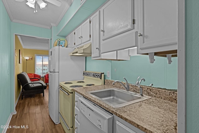 kitchen with white cabinets, wood-type flooring, white appliances, and sink