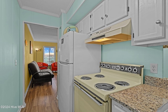 kitchen featuring electric range, white cabinetry, and crown molding