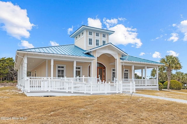 view of front of property with a front lawn and a porch