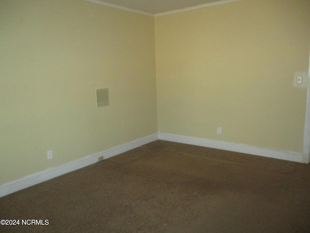 carpeted spare room featuring ornamental molding