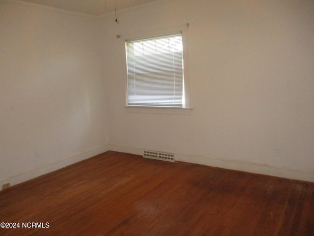 spare room featuring hardwood / wood-style flooring