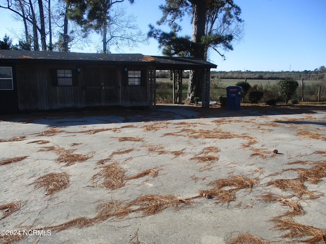 exterior space with a carport