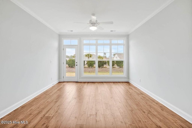 unfurnished room with crown molding, ceiling fan, and light wood-type flooring