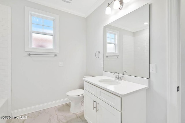 bathroom with vanity, crown molding, and toilet