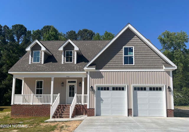 view of front of house with a porch and a garage