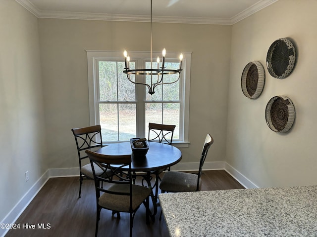 dining space featuring ornamental molding, an inviting chandelier, and dark wood-type flooring