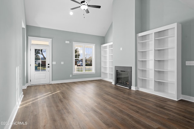 unfurnished living room featuring built in shelves, high vaulted ceiling, ceiling fan, and dark hardwood / wood-style floors