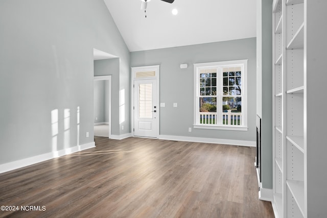 foyer featuring ceiling fan, high vaulted ceiling, and dark hardwood / wood-style floors