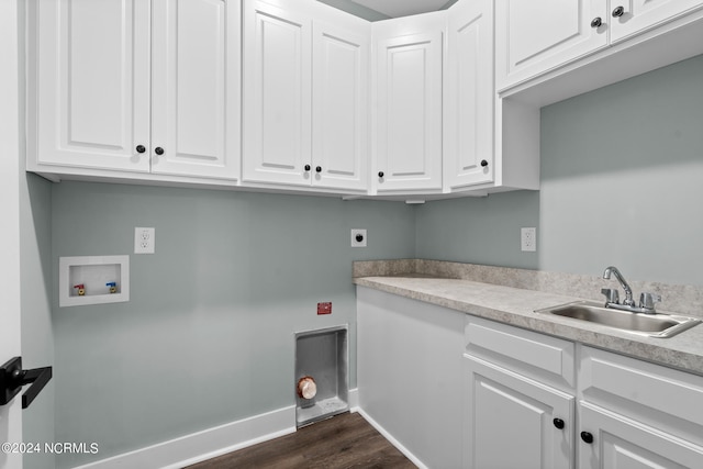 clothes washing area featuring electric dryer hookup, washer hookup, cabinets, dark hardwood / wood-style floors, and sink