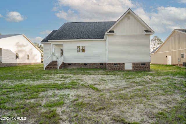 back of house with a yard