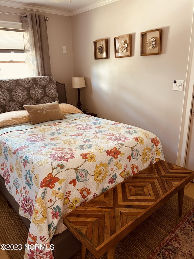 bedroom with ornamental molding