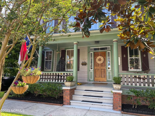 entrance to property with covered porch