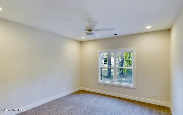 carpeted spare room with ceiling fan, recessed lighting, visible vents, and baseboards