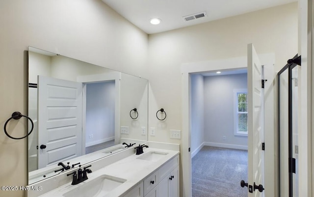 full bath with visible vents, a sink, and double vanity